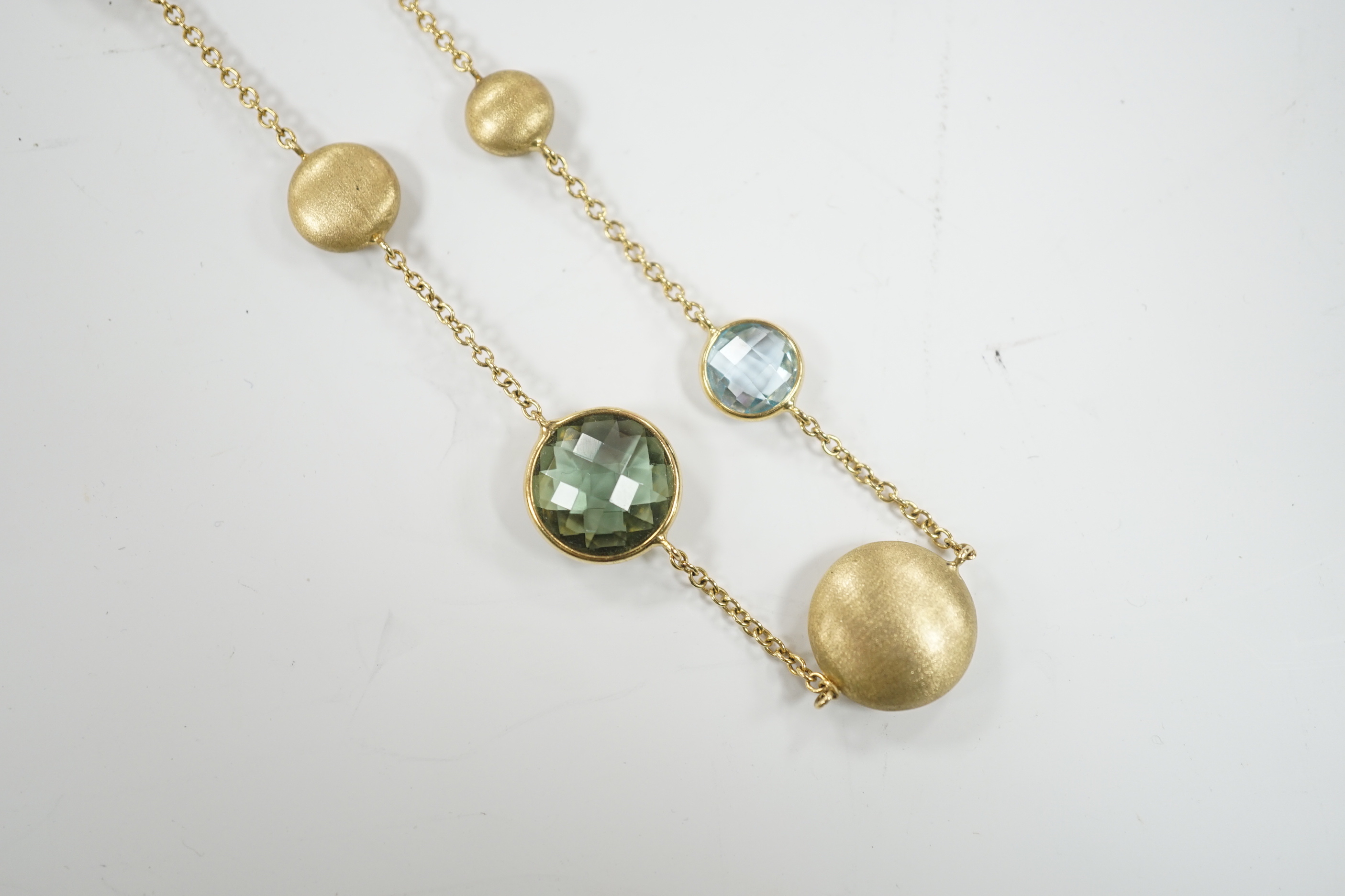 A modern Italian 9ct gold pebble and graduated multi gem set necklace, 68cm, gross weight 16 grams.